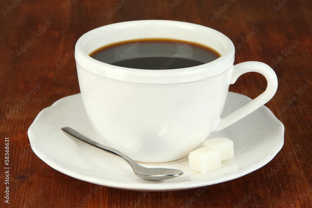 Coffee cup on wooden table close-up