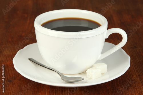 Coffee cup on wooden table close-up