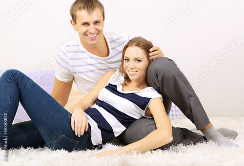 Happy young couple at home