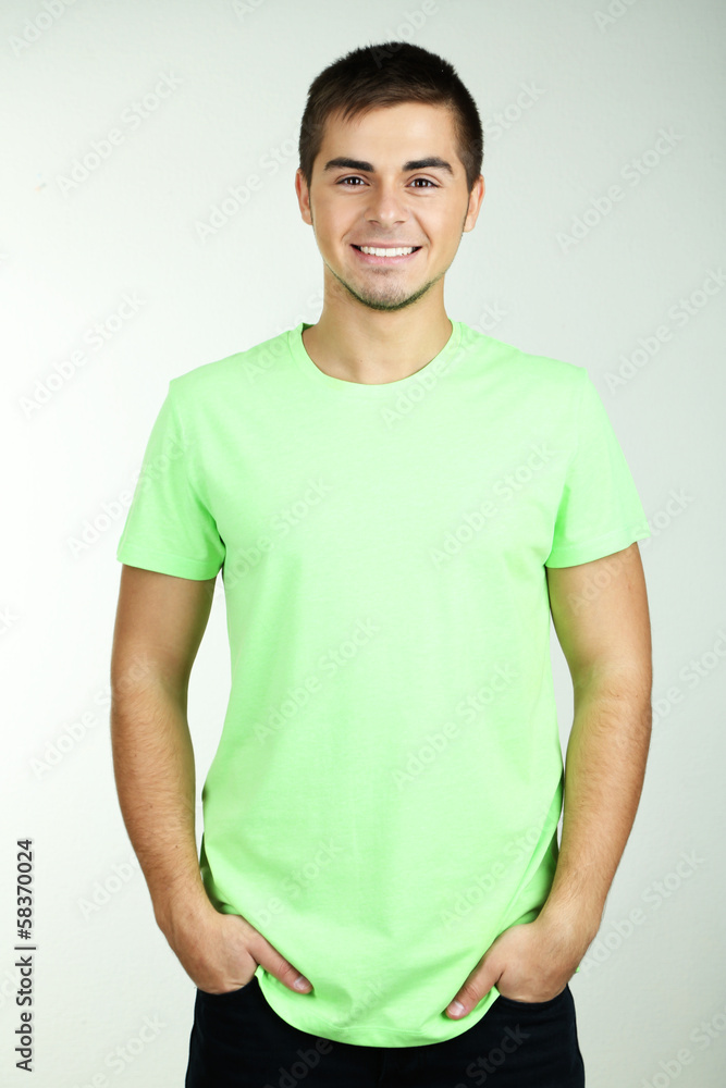 Portrait of young man on grey background Portrait of young man on grey background