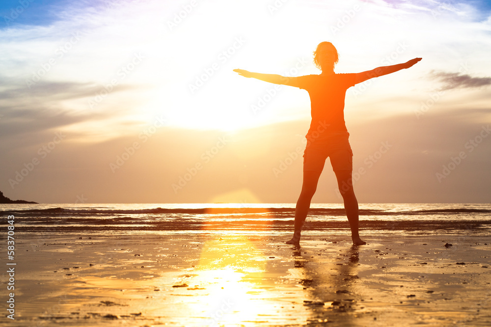 Silhouette young woman, exercise on the beach at sunset. Silhouette young woman, exercise on the beach at sunset.