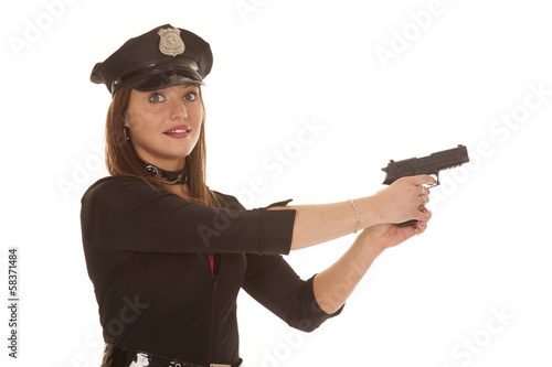 Canvas Print Woman cop point pistol to side
