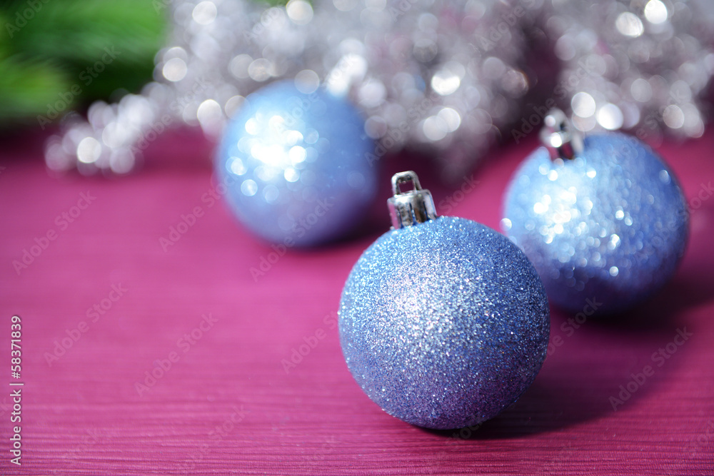 Christmas balls on fir tree, on color background Christmas balls on fir tree, on color background