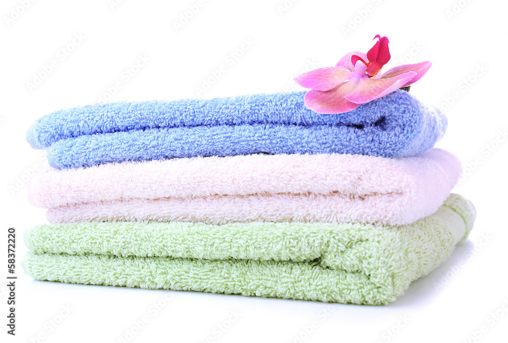 Orchid flower and towels, isolated on white Orchid flower and towels, isolated on white