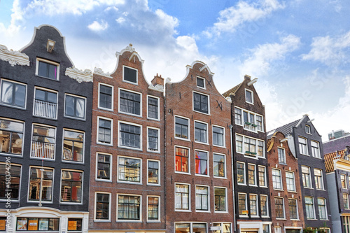 Amsterdam and typical houses with clear summer sky.Netherlands