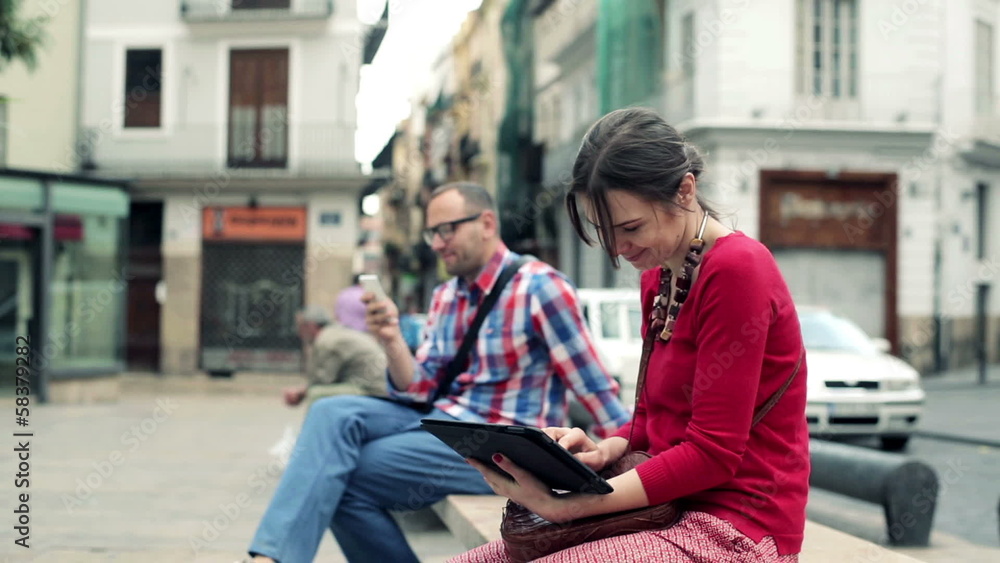 Young stylish woman with tablet computer in the city Young stylish woman with tablet computer in the city