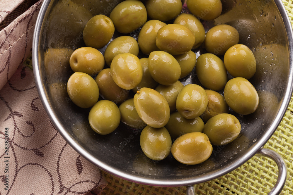 Green olive in bowl