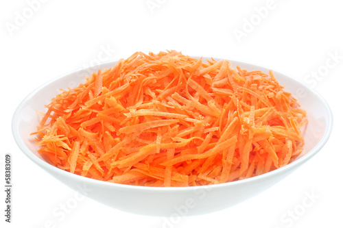 Raw grated carrots on a plate