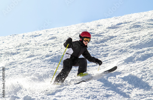 Young skier on an uneven slope