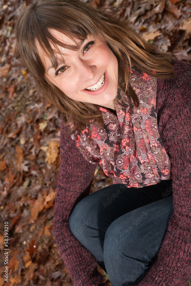 Happy girl on the autumn ground Happy girl on the autumn ground