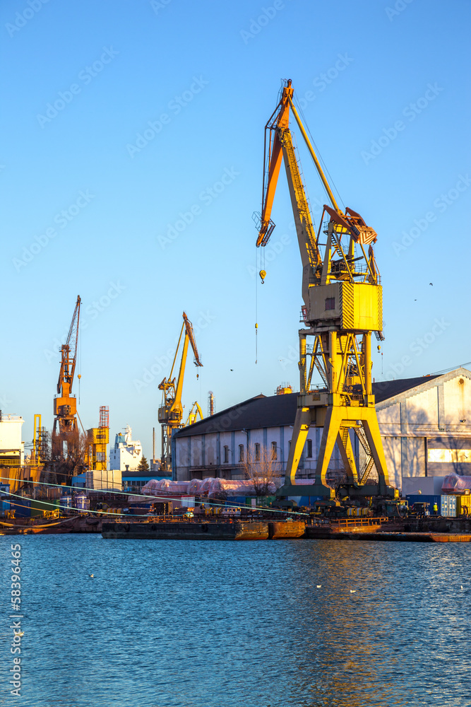Industrial shipyard yellow crane in Gdansk, Poland. Industrial shipyard yellow crane in Gdansk, Poland.