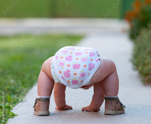 Baby is just playing on the street