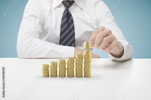 businessman puts coins