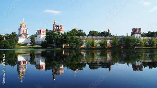 Novodevichy Convent and its mirror image on the water surface, M
