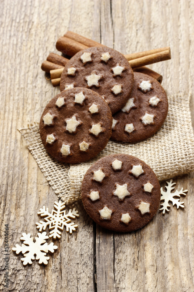 Round chocolate cookies decorated with icing stars Round chocolate cookies decorated with icing stars