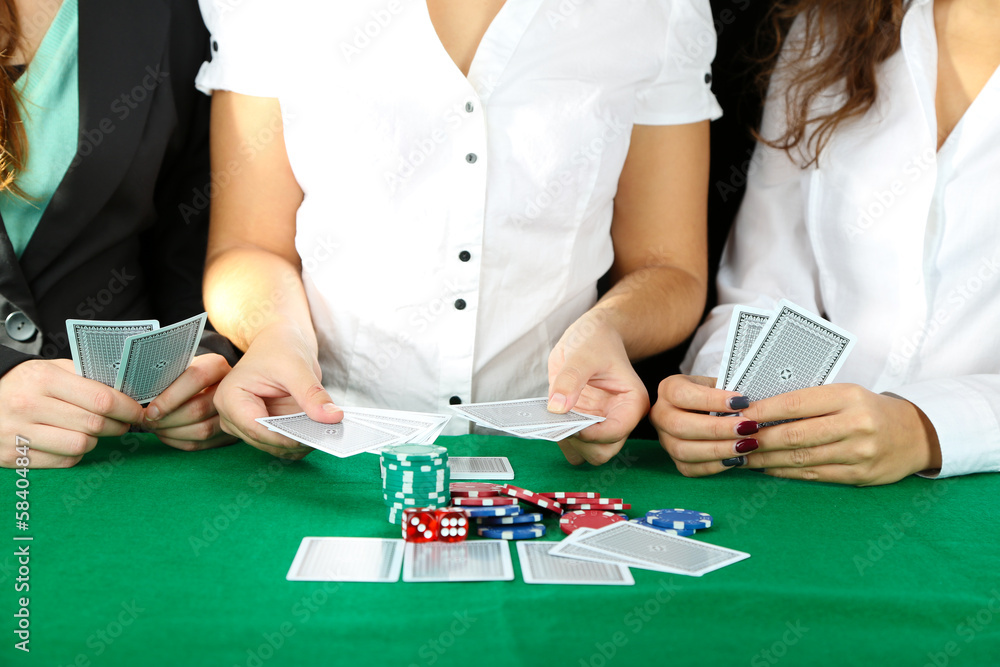 People playing cards at table People playing cards at table