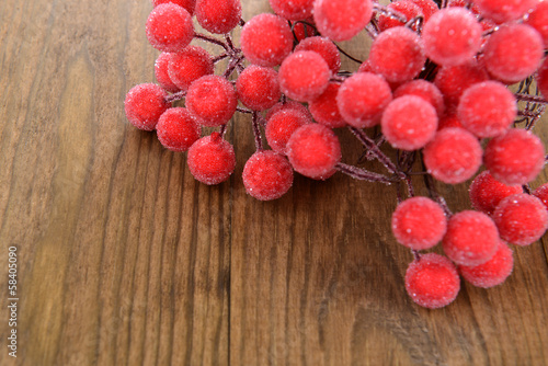 Christmas berry-decoration on wooden background
