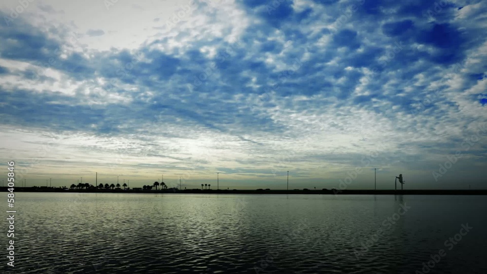 Cloudy blue sky time lapse over body of water Cloudy blue sky time lapse over body of water
