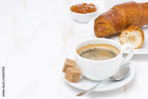 cup of black coffee and croissants (with space for text)