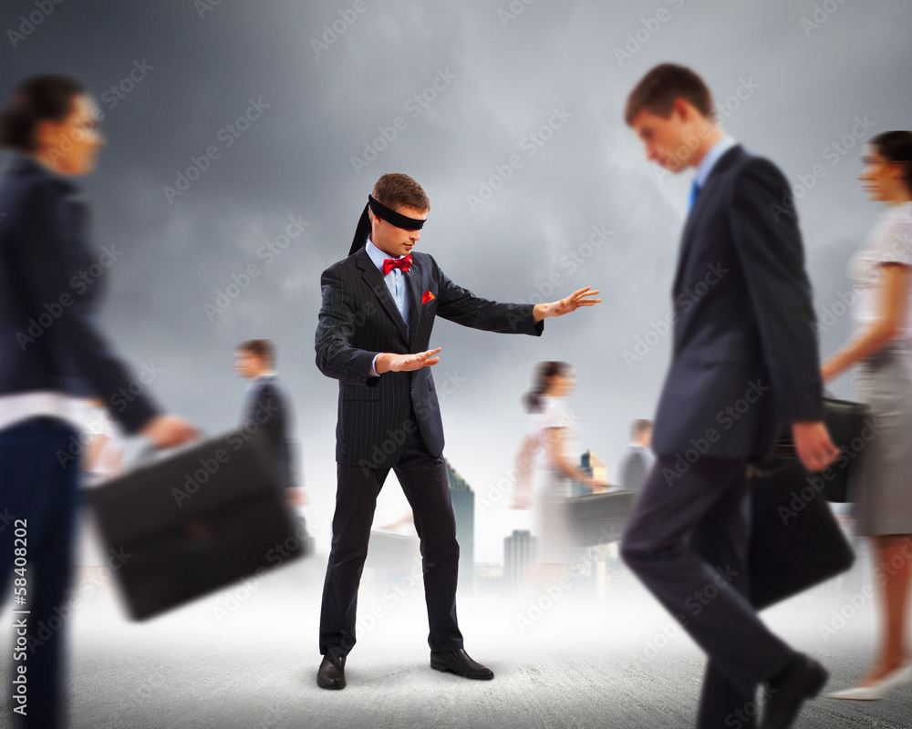 Businessman in blindfold among group of people Businessman in blindfold among group of people