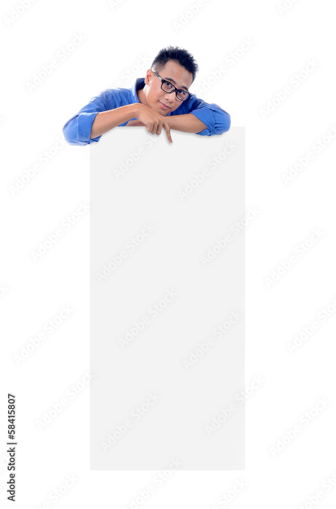 Young man holding blank billboard Young man holding blank billboard