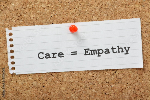 Care equals Empathy on a cork notice board