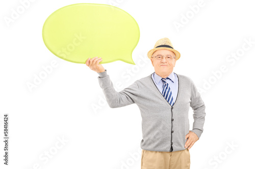 Senior smiling gentleman holding an empty speech bubble