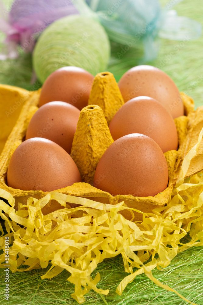Real eggs with decorative in the background Real eggs with decorative in the background