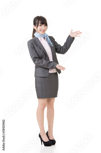 Attractive business woman showing or introducing