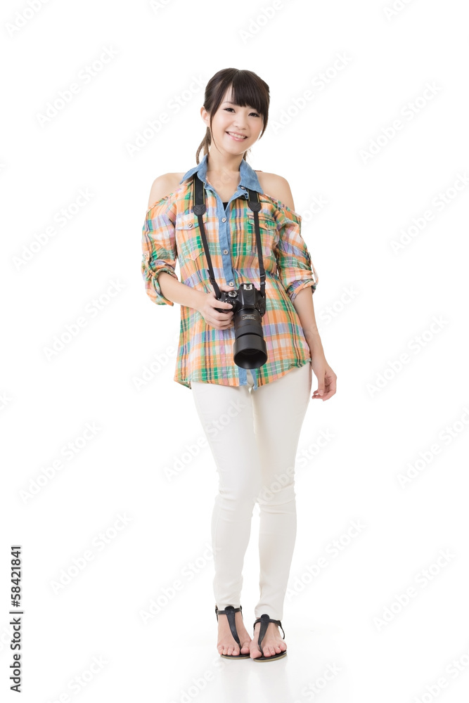 Smiling asian woman with photo camera Smiling asian woman with photo camera