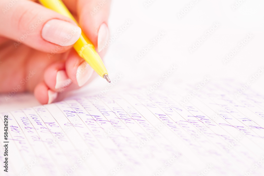 Business Woman Writing with pen in notepad Business Woman Writing with pen in notepad