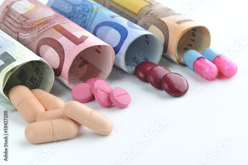 medical pills and tablets in euro bank notes money costs symbol