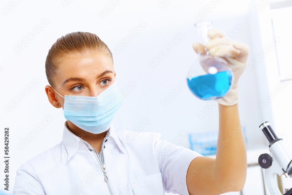 Young female scientist working in laboratory Young female scientist working in laboratory