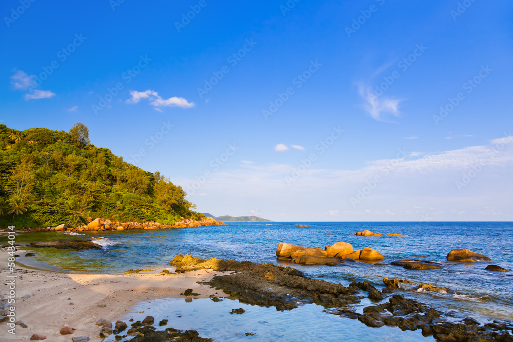 Tropical beach in Seychelles at sunset