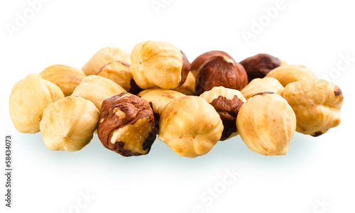 A pile of shell-less hazelnuts, isolated on white background
