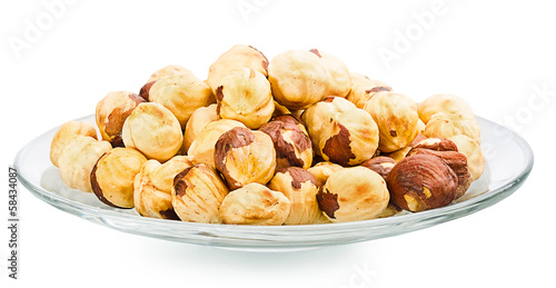 A pile of shell-less hazelnuts, isolated on white background
