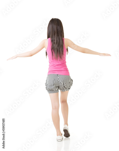 Fotografie Young asian woman walking on imaginary rope