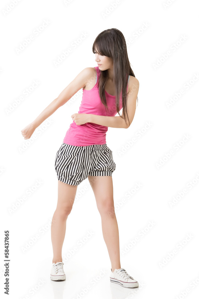 Fototapeta premium Young asian woman pulls an imaginary rope