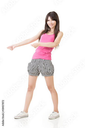 Young asian woman pulls an imaginary rope