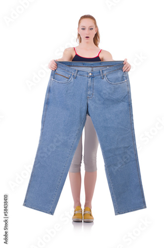 Woman with large jeans in dieting concept