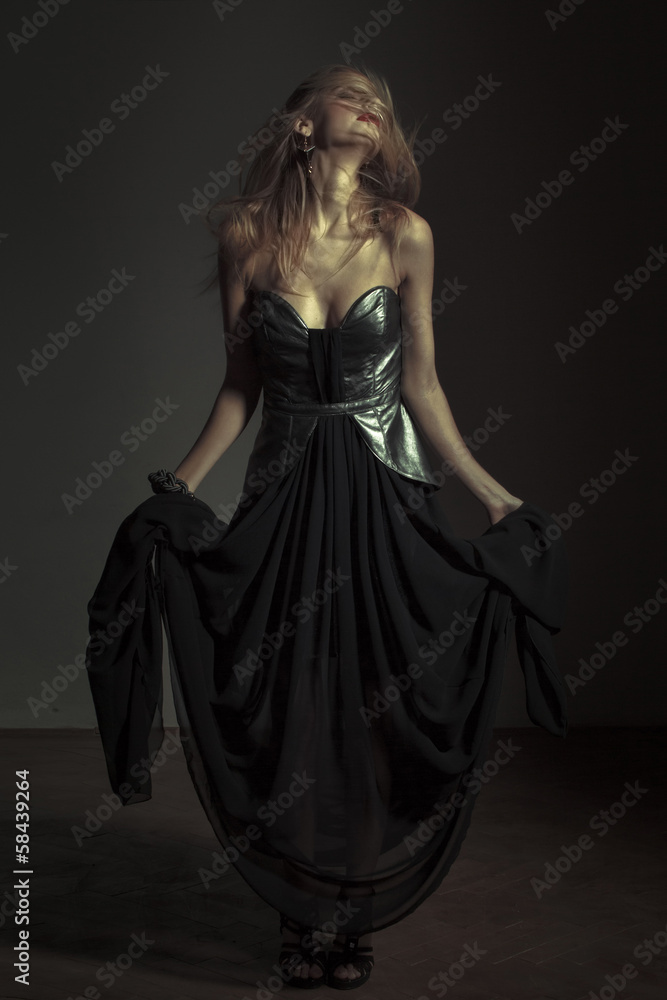 Sexy emotional woman posing in evening dress Sexy emotional woman posing in evening dress