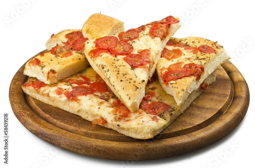 Focaccia with tomatoes and oregano close up