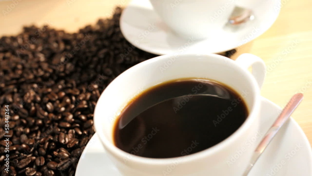 Fresh Coffee Beans Pouring Onto White Table Female Hands Fresh Coffee Beans Pouring Onto White Table Female Hands