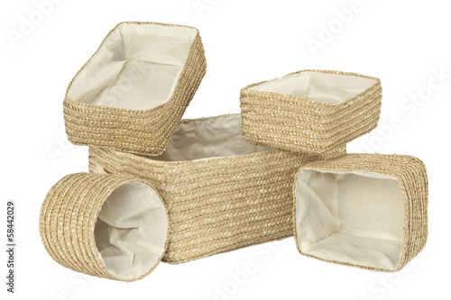 Various braided bamboo baskets on white