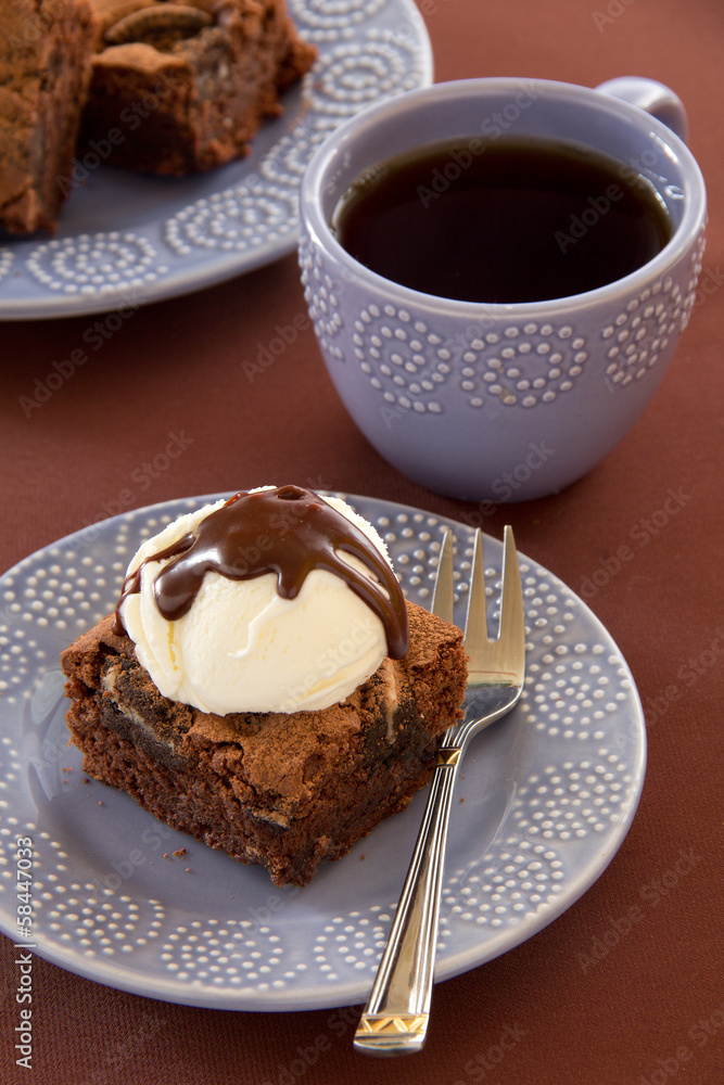 Chocolate brownie cake with a scoop of ice cream. Chocolate brownie cake with a scoop of ice cream.