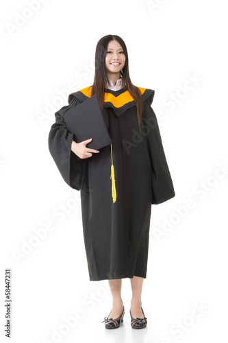 Beautiful smiling young graduation woman standing