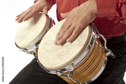 Man playing bongo set on his lap