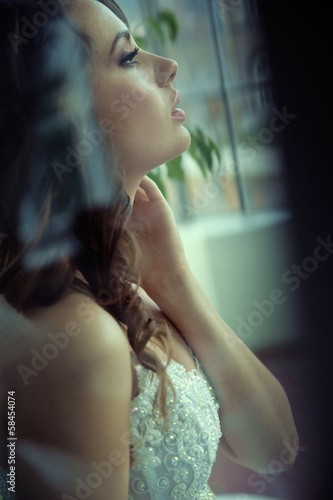 Profile portrait of delightful bride