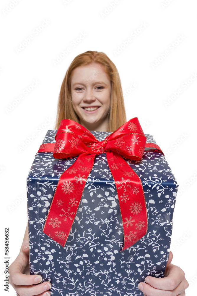 Young red haired Girl presenting a gift Young red haired Girl presenting a gift