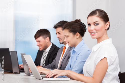 Businesspeople Using Laptop